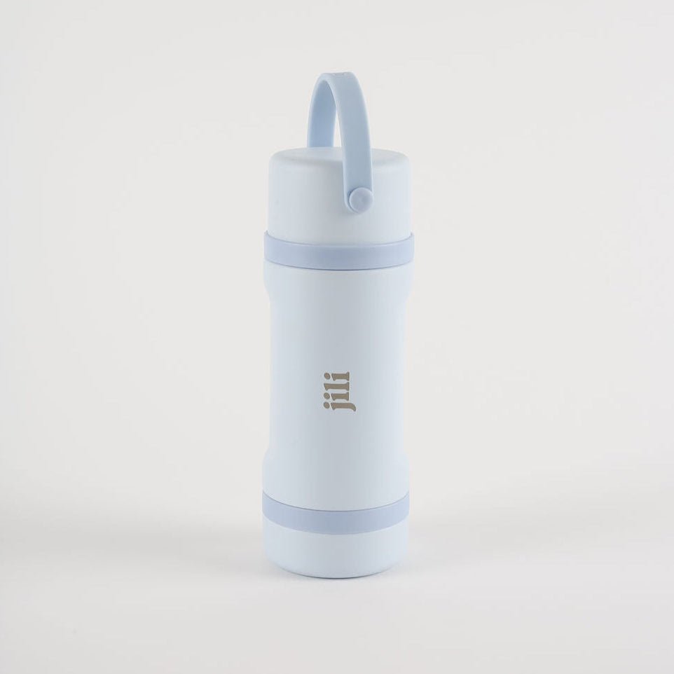 Light blue water bottle with a strap on a light gray background