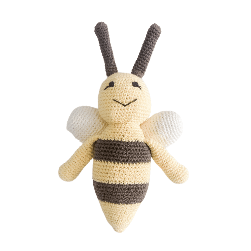 Crocheted bee toy on a white background