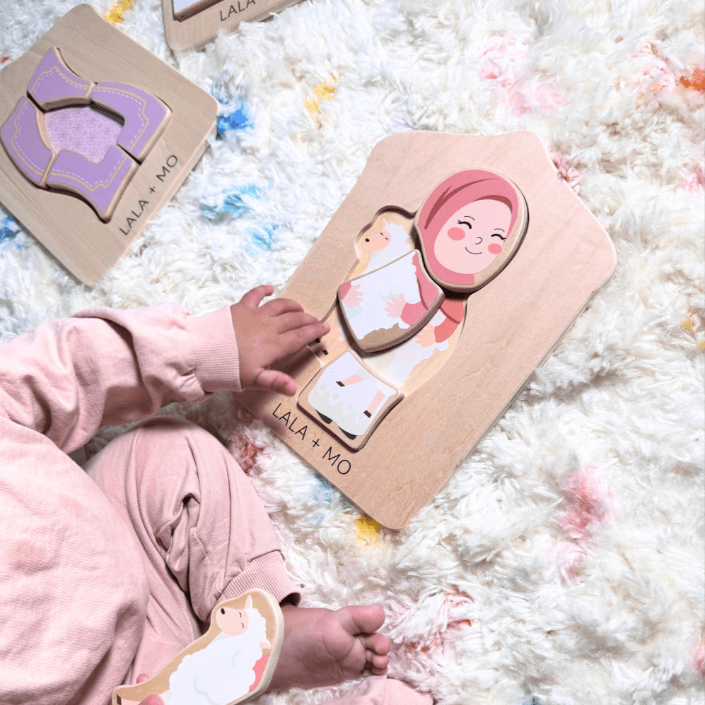 Child playing with a wooden puzzle toy on a soft surface