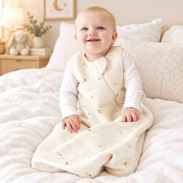 Baby in a white outfit with a soft texture on a white background