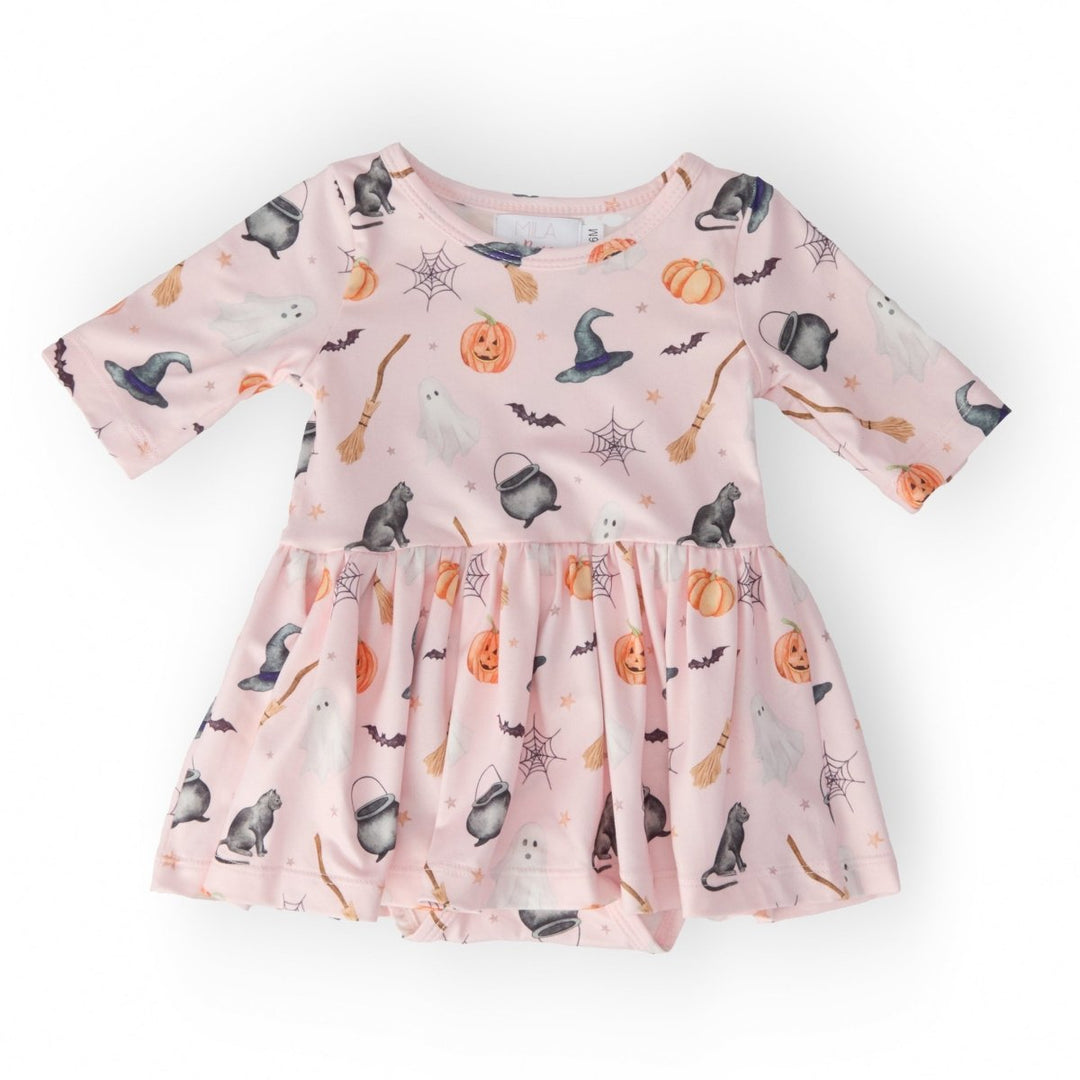 Pink dress with Halloween-themed pattern on a white background