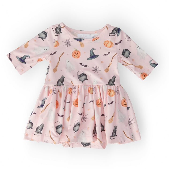 Pink dress with Halloween-themed pattern on a white background