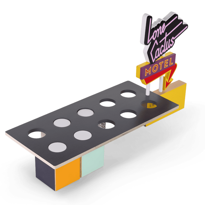 A retro-futuristic sci-fi desk or console featuring a dark gray top with circular cutouts, a yellow side panel, and a neon-style &