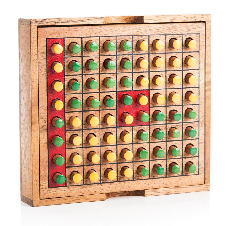 Wooden board game with colored pegs on a white background