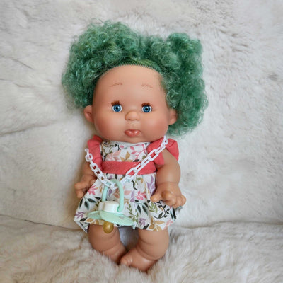 Pepote doll with green hair and floral dress