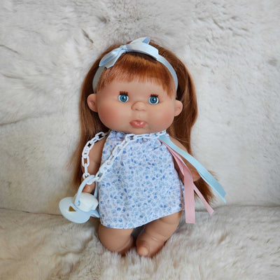 Pepote with red hair and blue eyes wearing a floral outfit