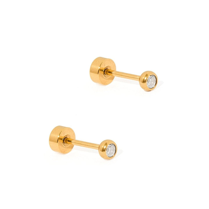 Pair of gold stud earrings with clear gemstones on a white background