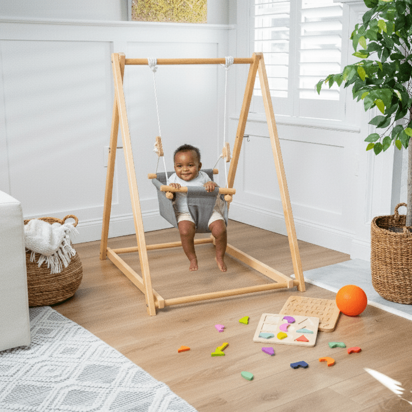 Child playing with a wooden swing set in a room with toys on the floor.