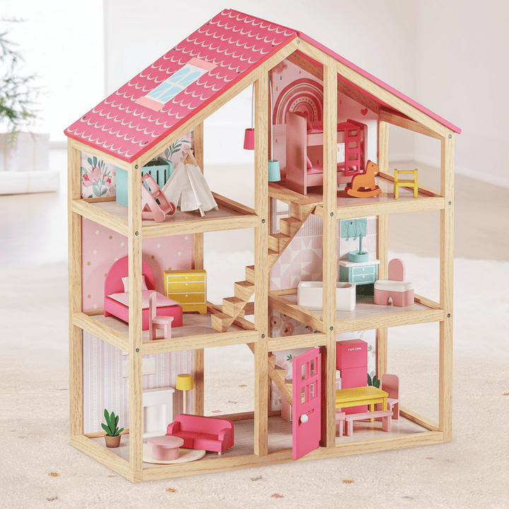 Wooden dollhouse with pink roof and colorful furniture on a light surface.