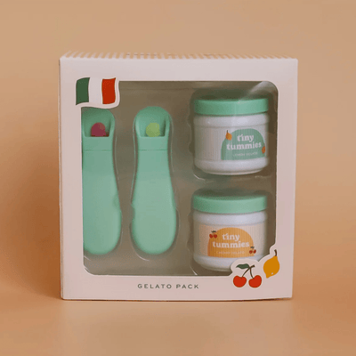Gelato pack with two jars and a spoon in a box on a beige background