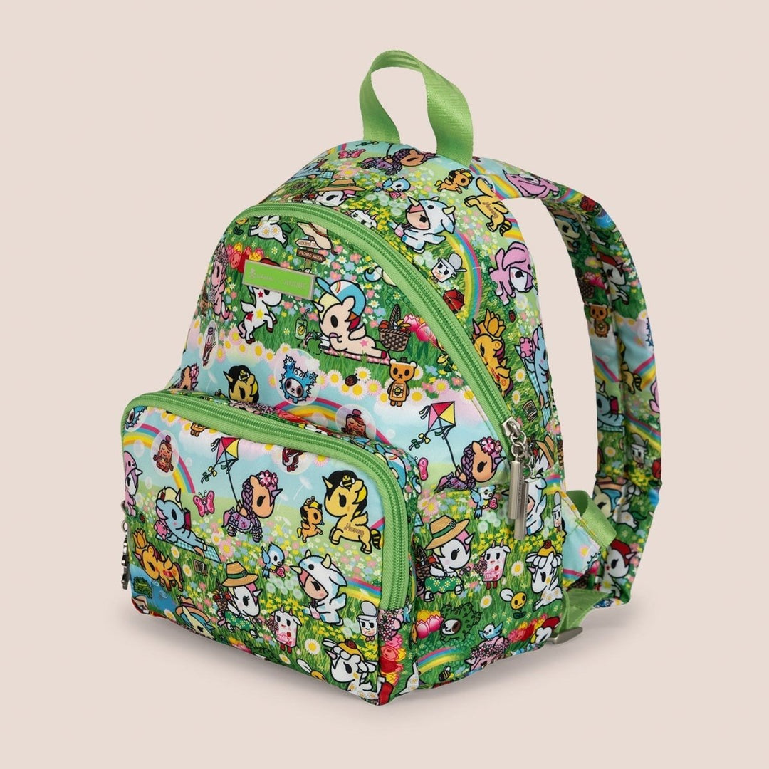 Colorful backpack with cartoon character print on a beige background