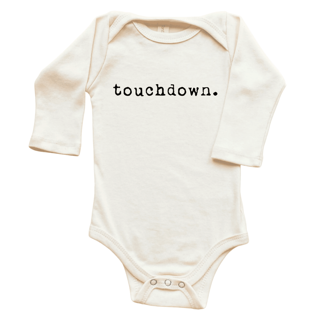 An off-white long-sleeve baby bodysuit with the word &