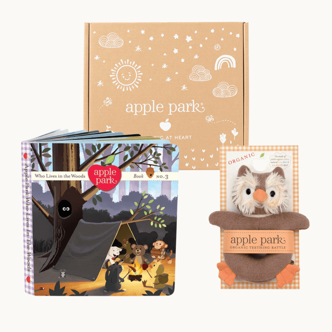 Collection of Apple Park products including a book, plush owl, and baby blanket on a white background.
